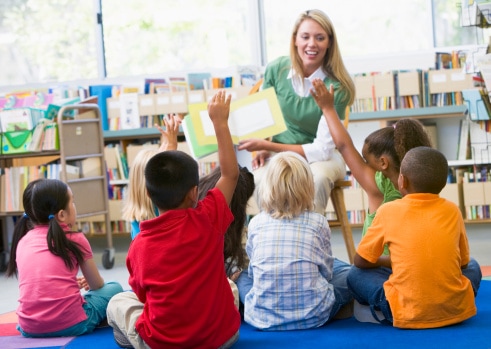 Teacher reading with children